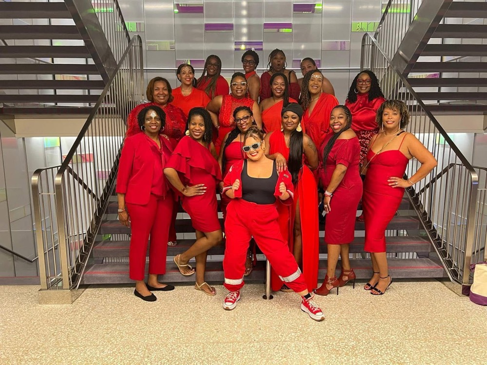 Wholelistic women dressed in red on a cruise ship staircase
