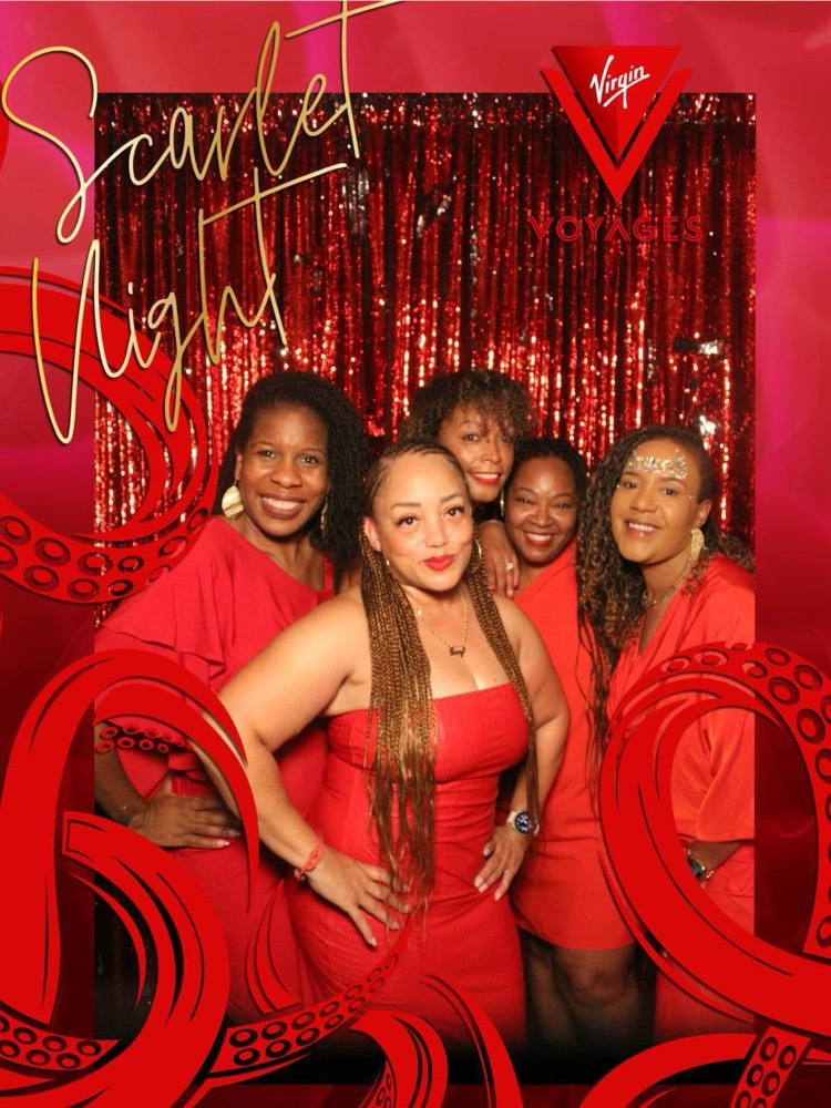 Wholelistic members dressed in red at a celebration